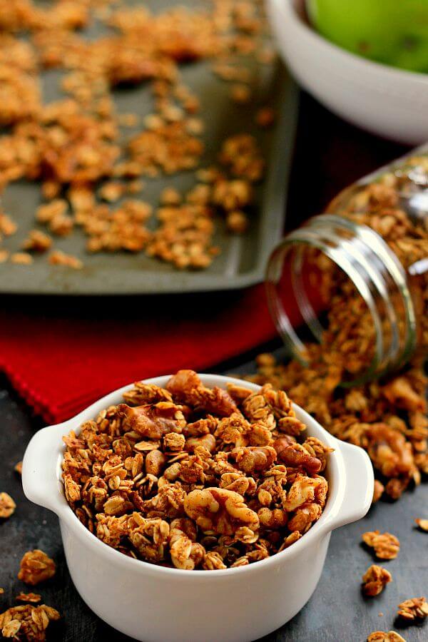 apple pie granola in a dish, baking pan, and mason jar