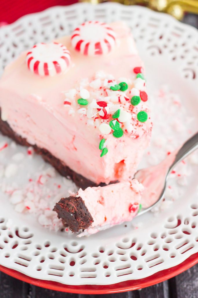 A bite of peppermint cheesecake on a fork