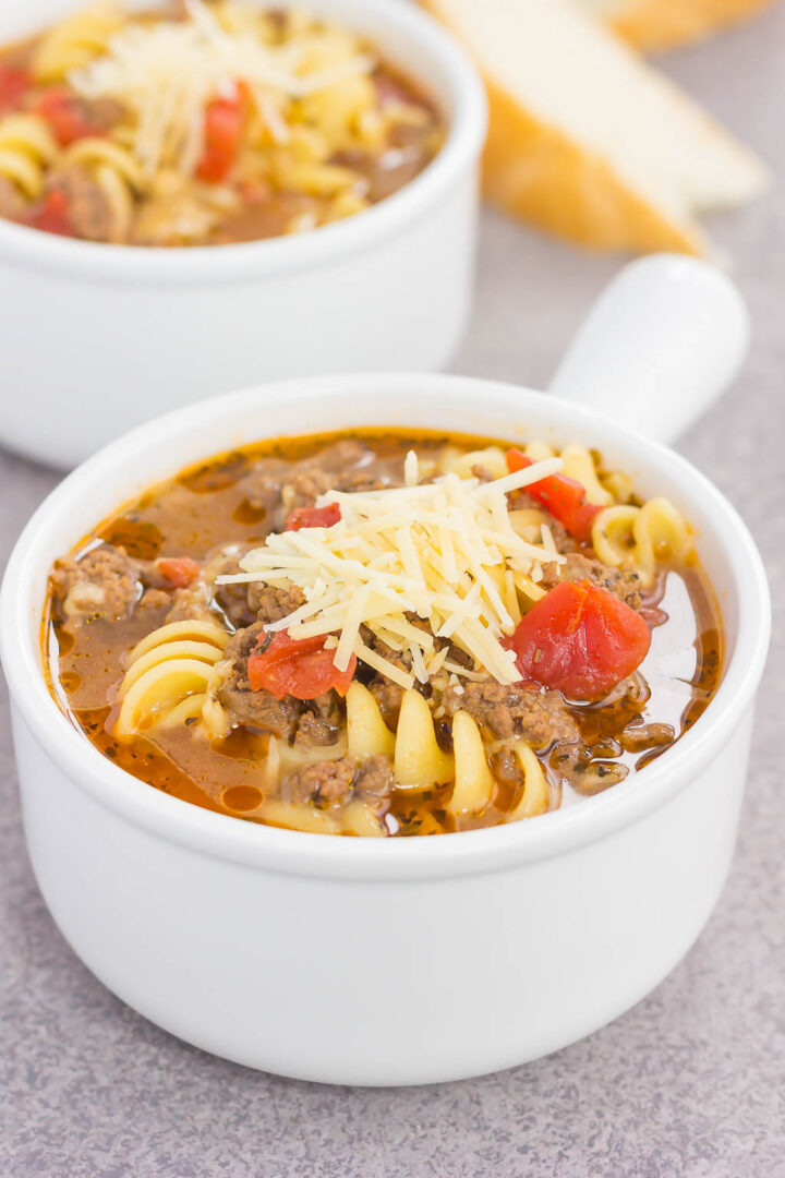 a white soup bowl with lasagna soup in it