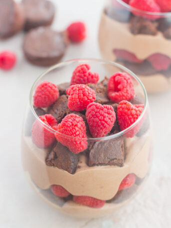 Raspberry Brownie Parfaits make a simple dessert that's ready in no time. Rich brownie chunks and fresh raspberries are layered together with whipped chocolate pudding to create the perfect sweet treat!