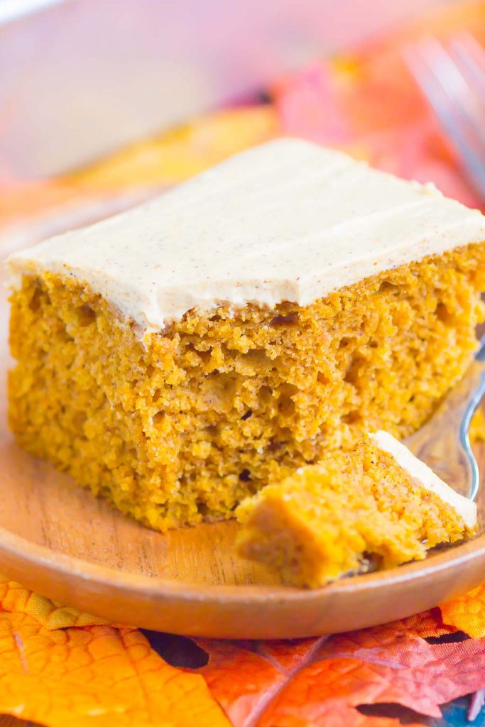 a slice of pumpkin spice cake with a bite on a fork