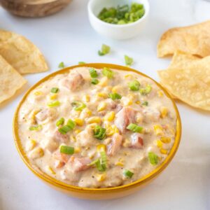 corn dip in a brown bowl