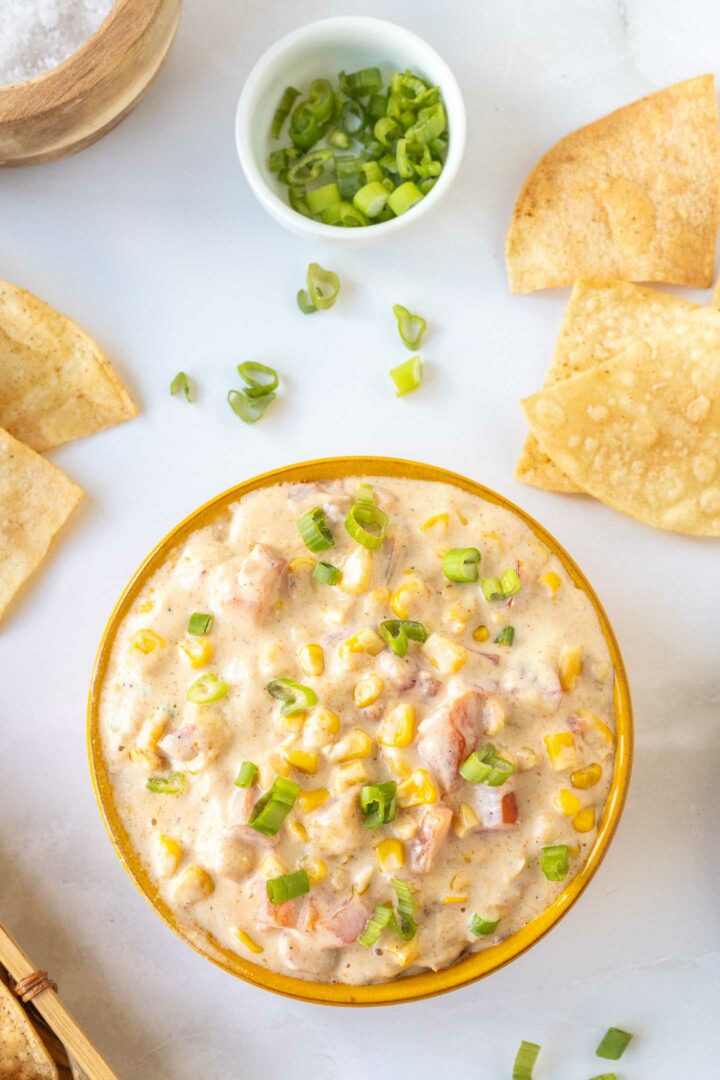 corn dip in a brown bowl