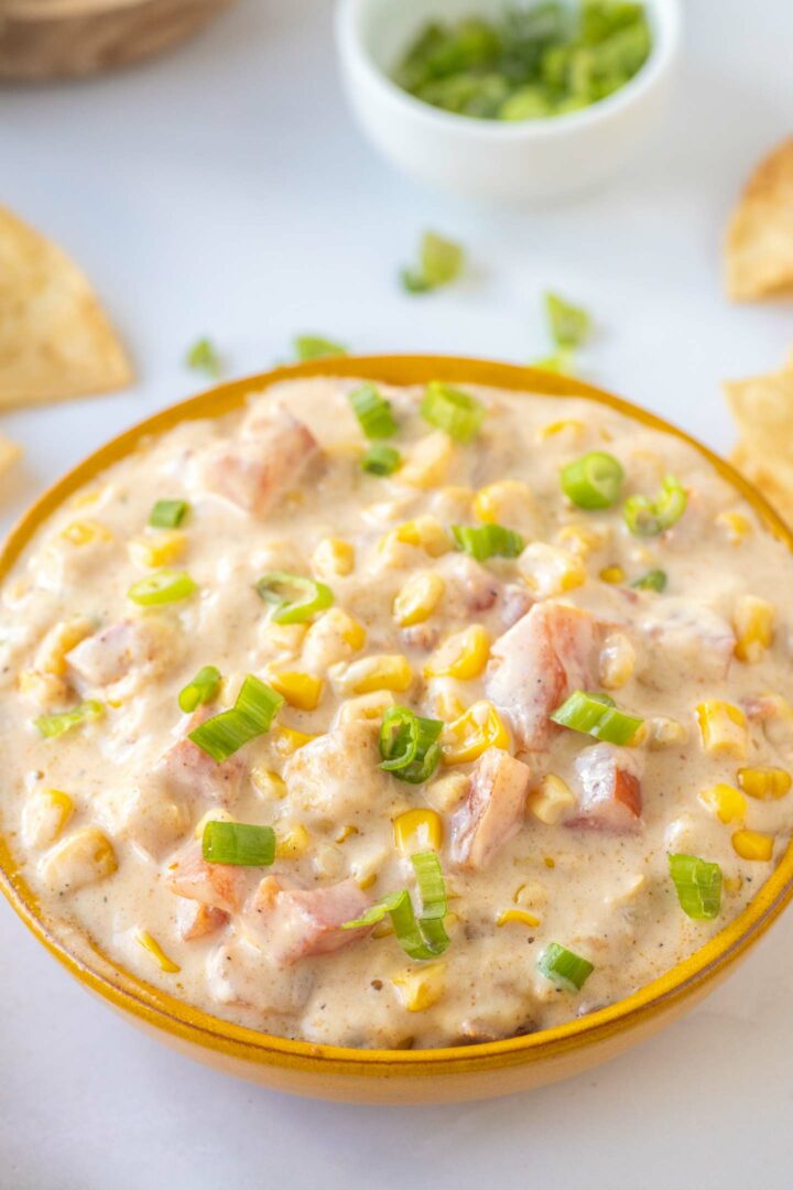 corn dip in a brown bowl