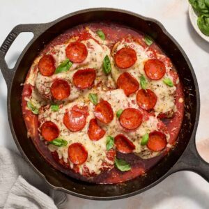 pizza chicken bake in a black skillet