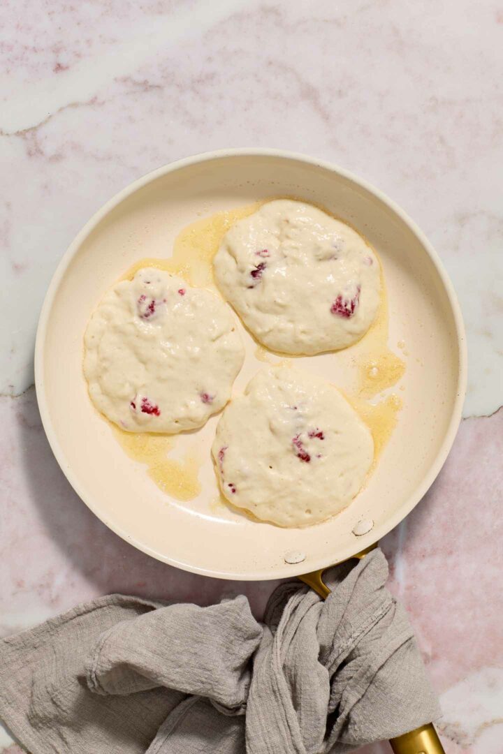 pancake batter in a white skillet