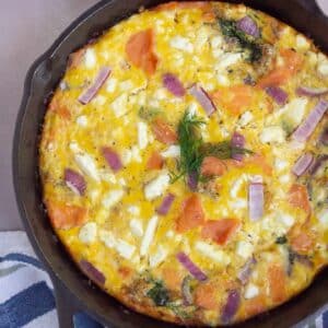 salmon frittata in a black skillet