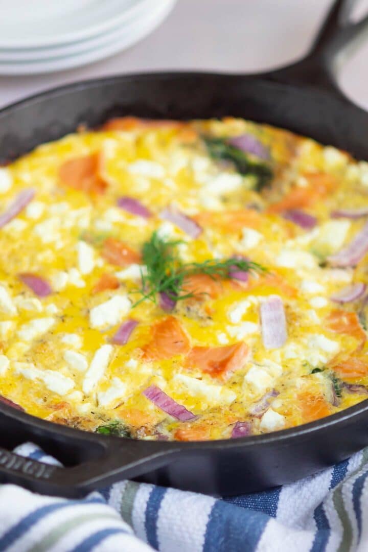 salmon frittata in a black skillet