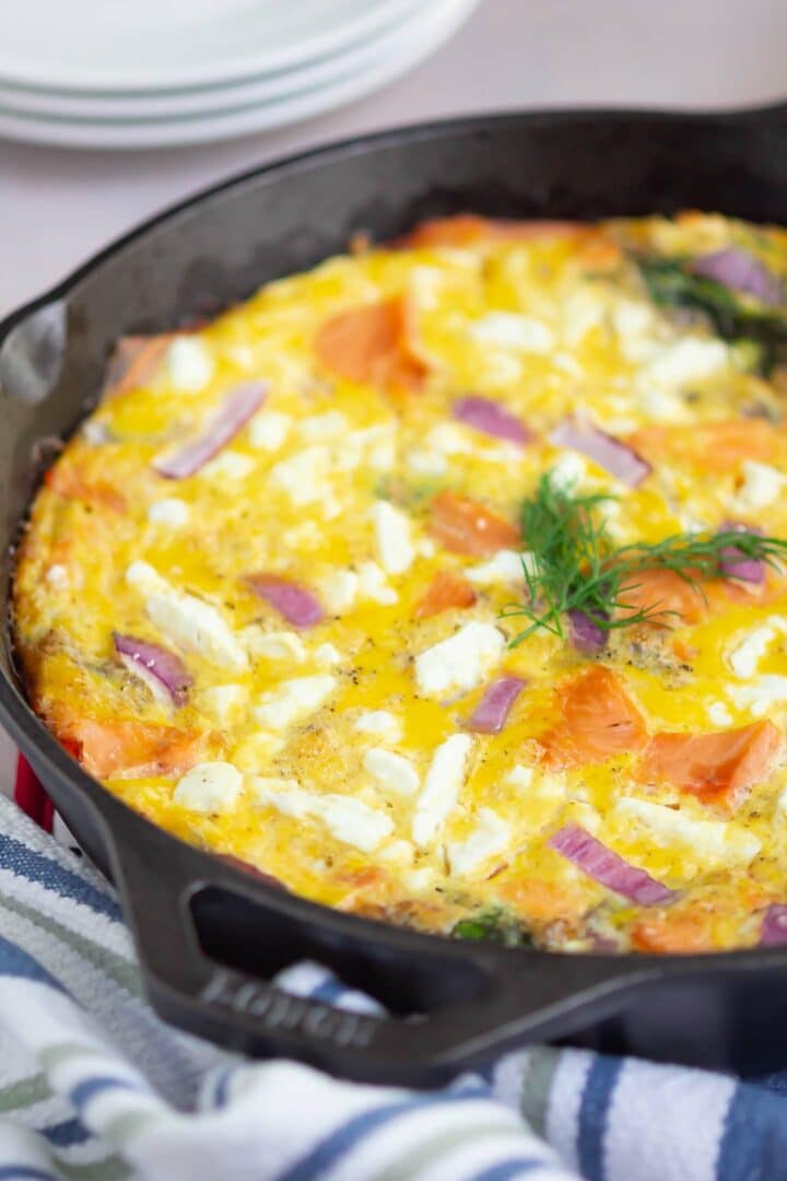 salmon frittata in a black skillet