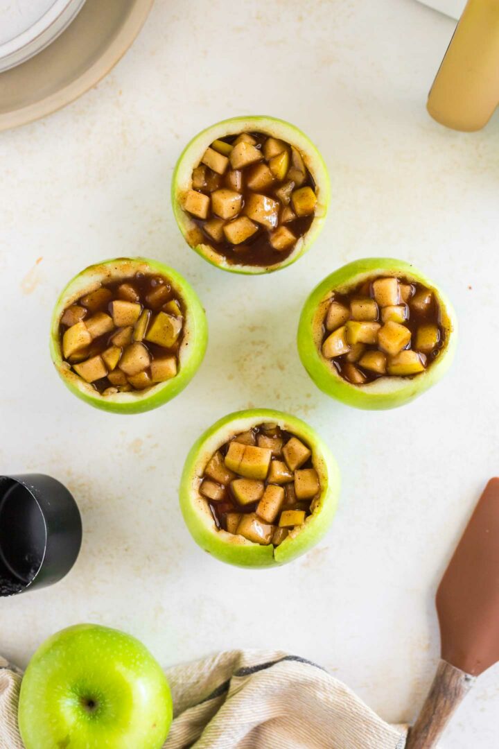 apple filling in four hollowed apples