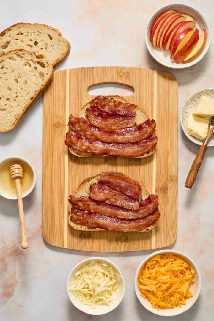 bread with bacon and honey on a cutting board