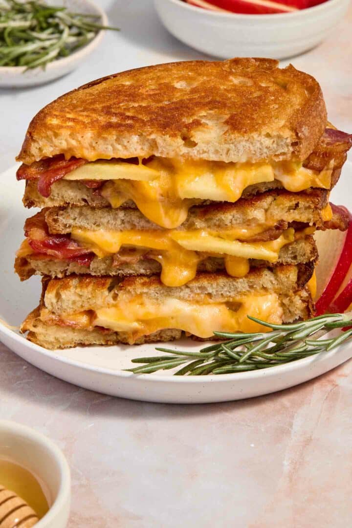 grilled cheese stacked on a white plate