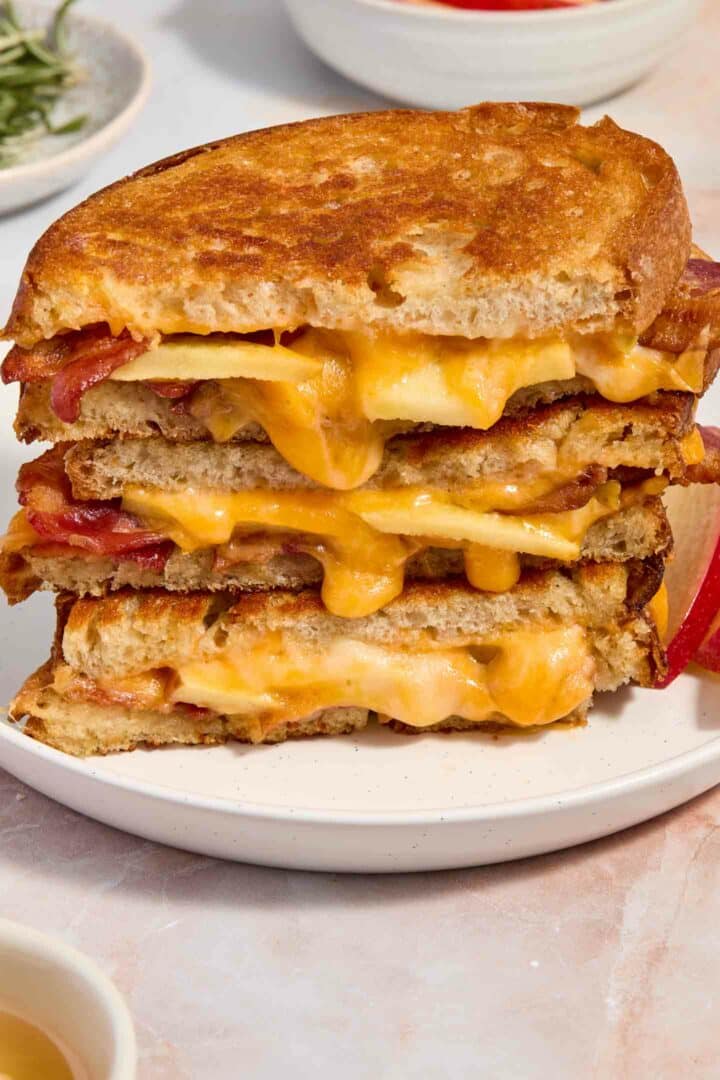 grilled cheese stacked on a white plate