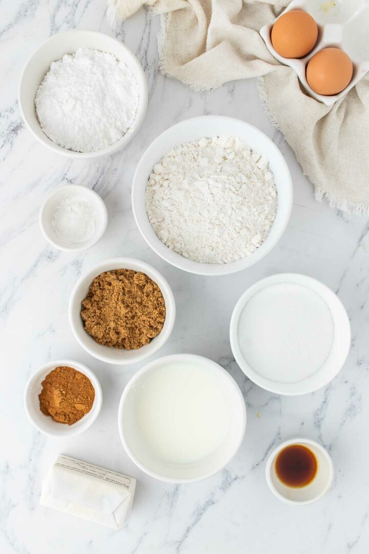 ingredients in white bowls on a white surface