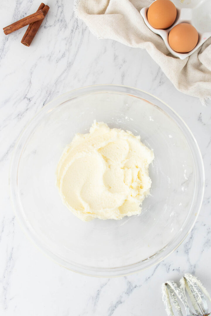 butter and sugar creamed in a glass bowl