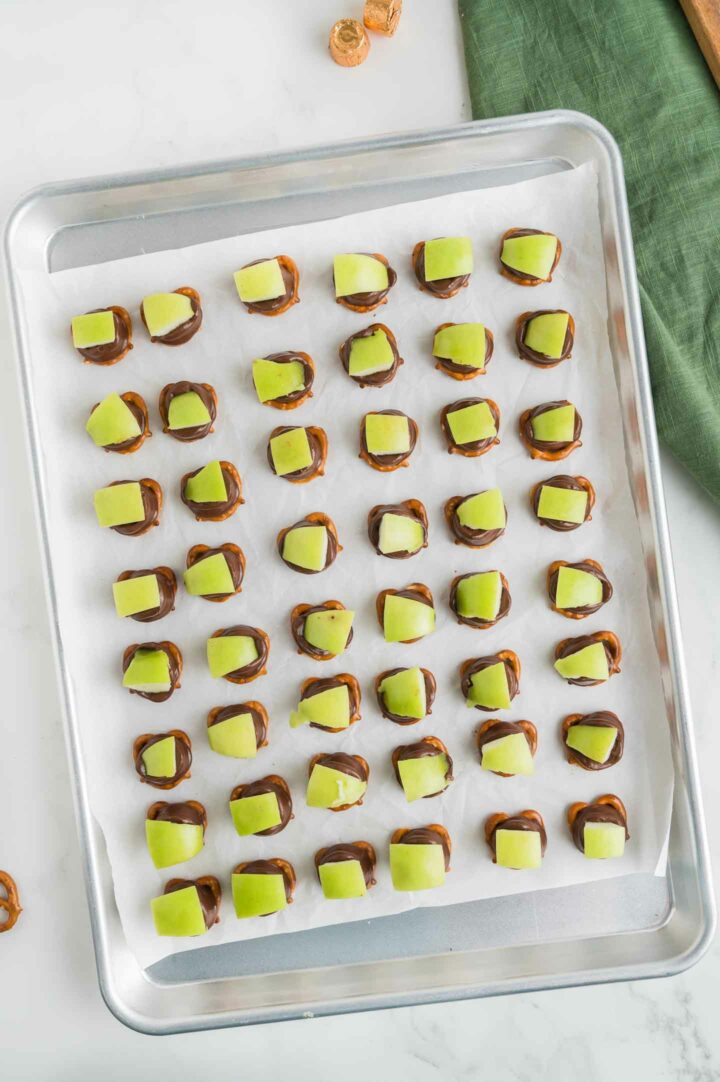 apple pretzel bites fully assembled on a baking pan