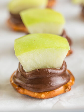 apple pretzel bites on a white surface