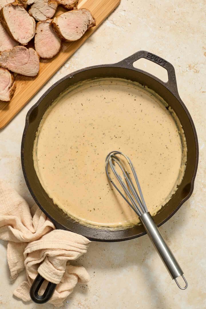 cream sauce in black skillet