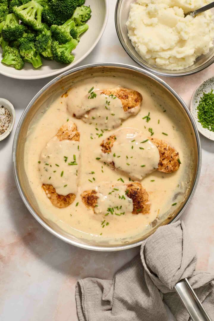 chicken in a skillet with cream sauce