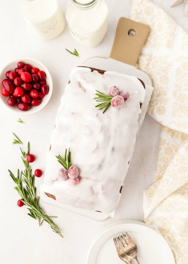 loaf with icing on a white platter