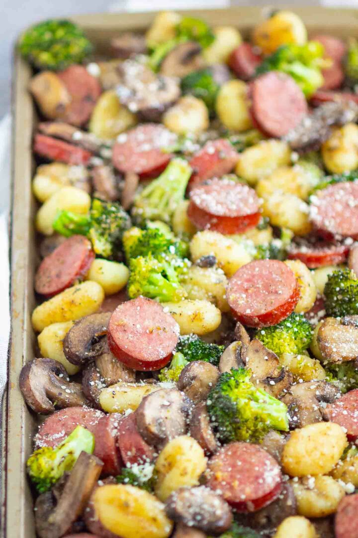 sausage, gnocchi, broccoli, mushrooms on a sheet pan