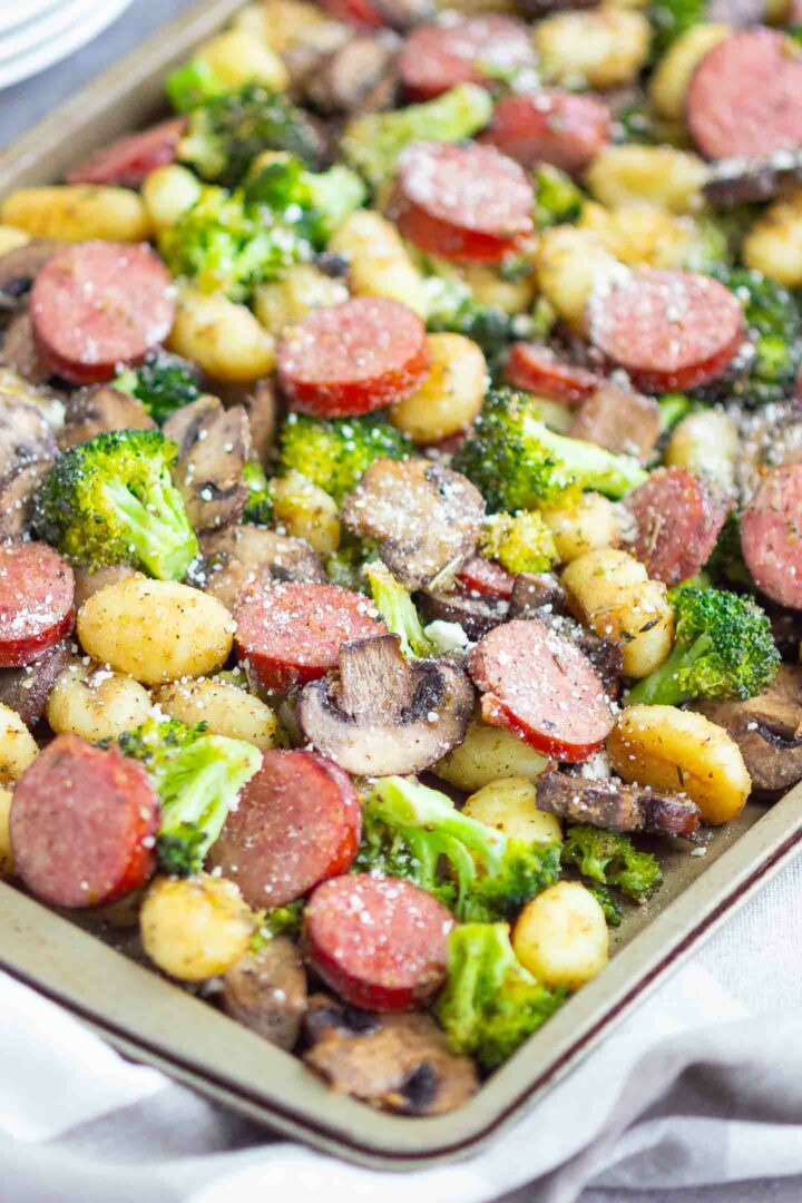 sausage, gnocchi, broccoli and mushrooms on a sheet pan