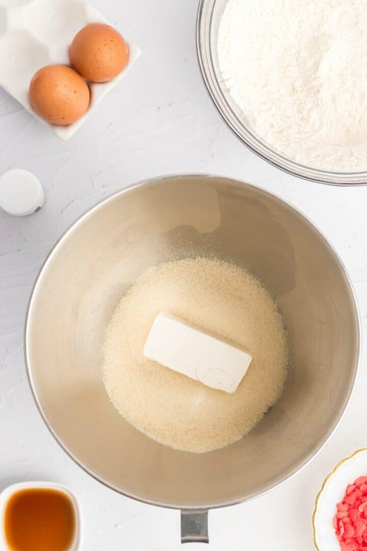 butter and sugar in a metal mixing bowl