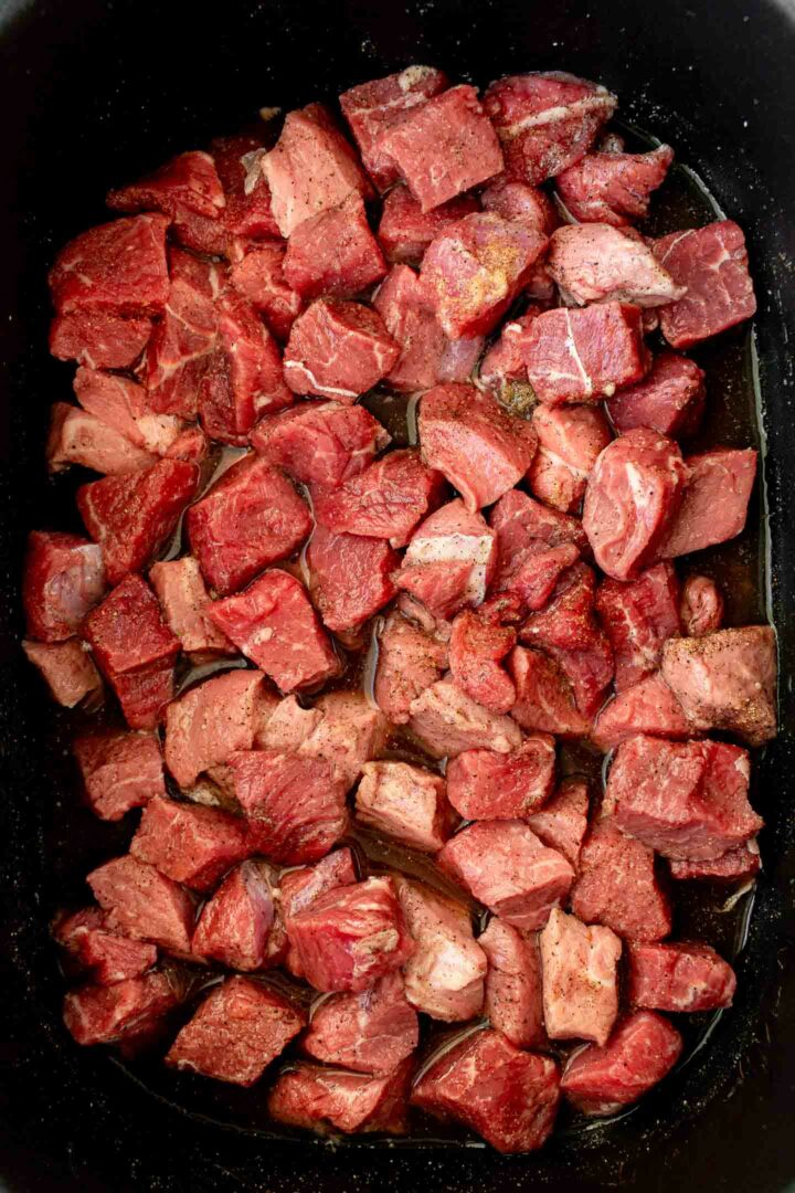 raw steak bites in the slow cooker