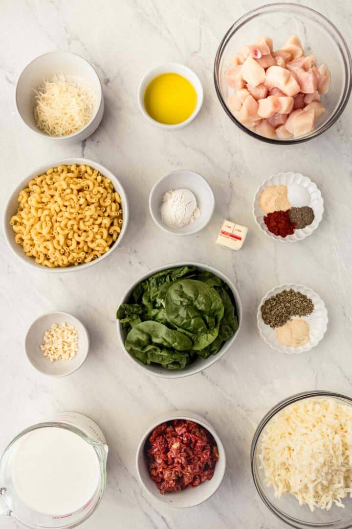 chicken mac and cheese ingredients in small white bowls