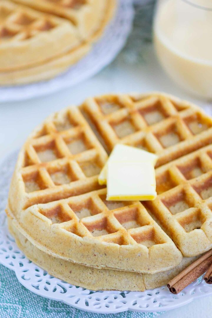 waffles with butter on a white plate