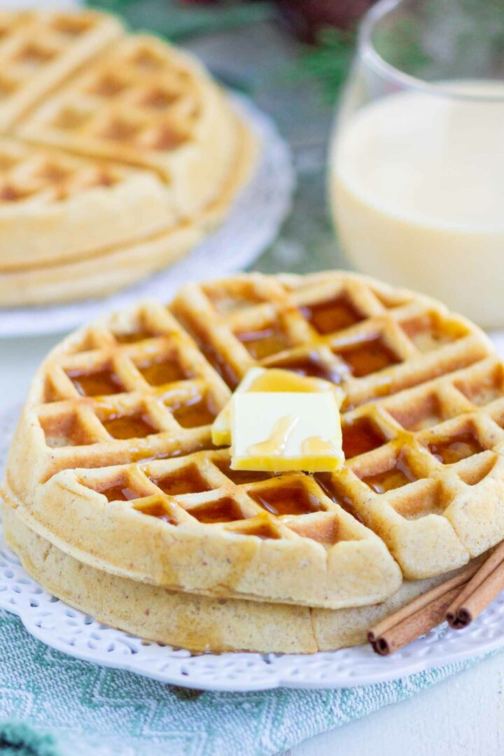 waffles with butter and syrup on a white plate