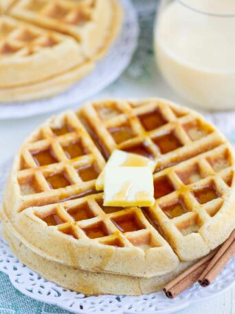 waffles with butter and syrup on a white plate