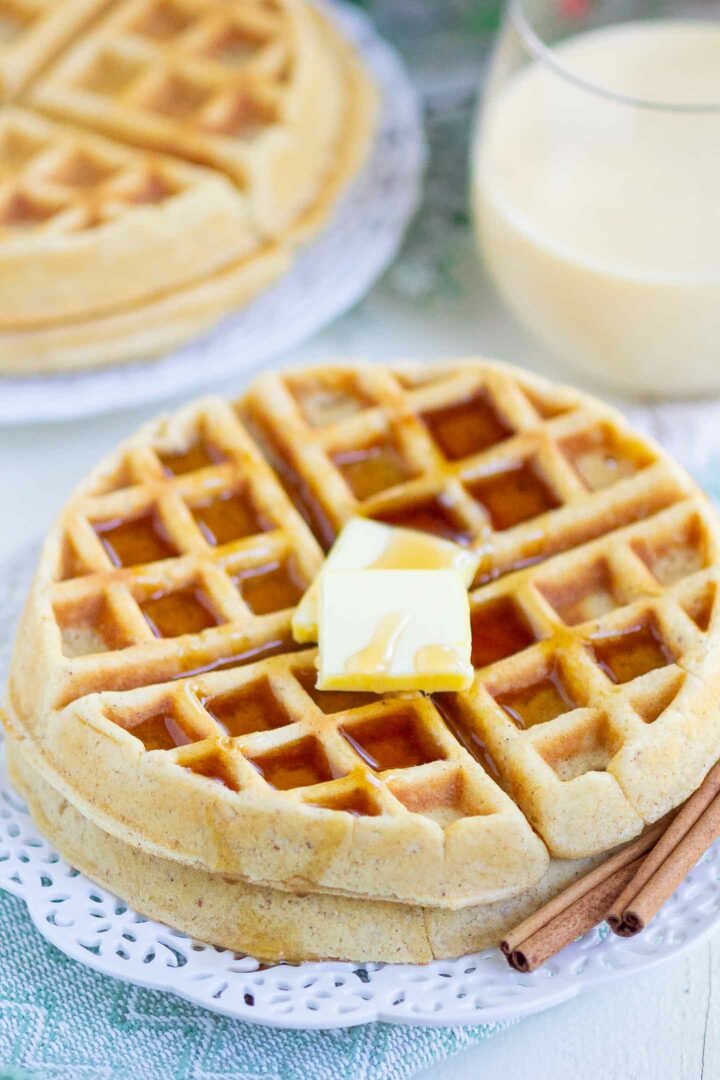 waffles with butter and syrup on a white plate