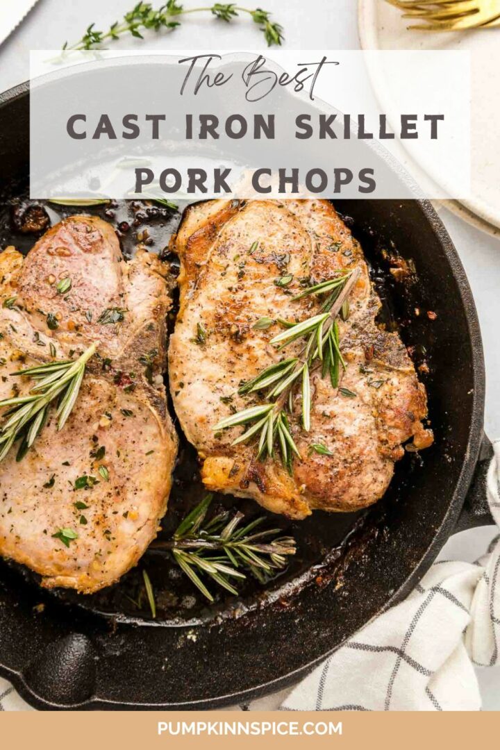 pork chops in a black cast iron skillet with rosemary and herbs