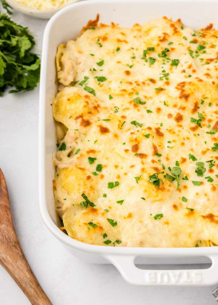 baked ravioli shown in a white dish