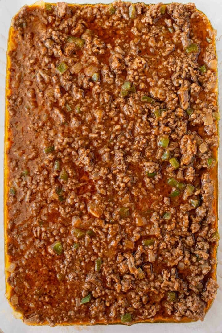 ground beef mixture spread in a baking dish