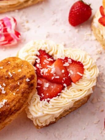 puff pastry heart shown with white chocolate mousse and strawberries