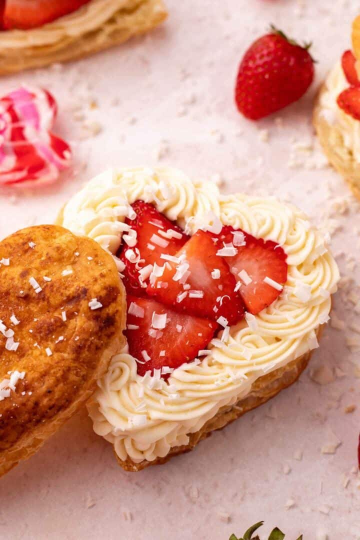 puff pastry heart shown with white chocolate mousse and strawberries