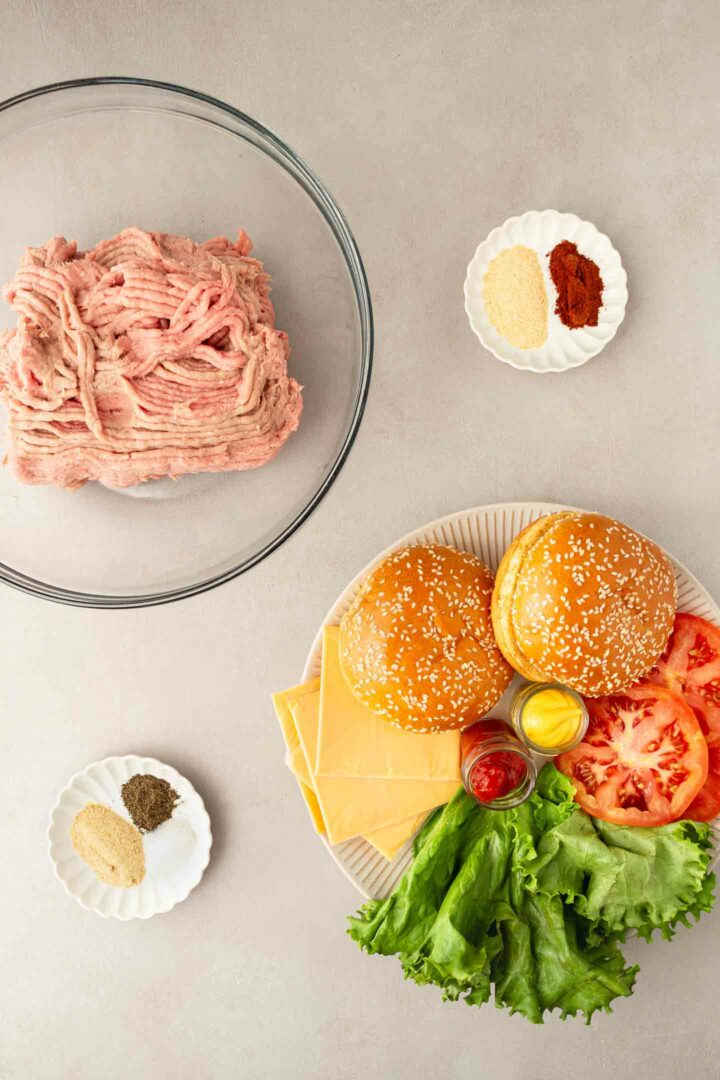 turkey burger ingredients in bowls and on a plate