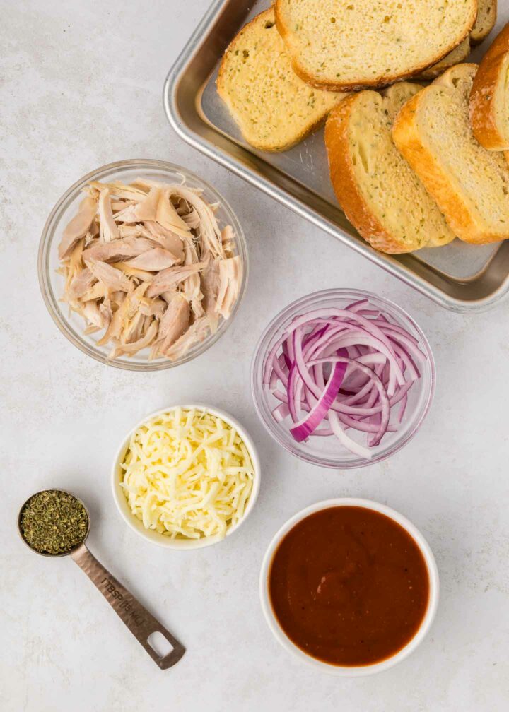 ingredients shown in bowls and on a sheet pan