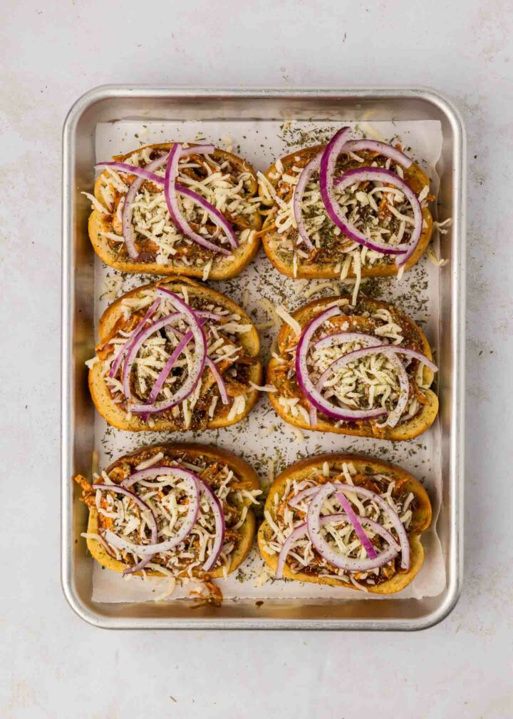 chicken, shredded cheese and onions added to toast